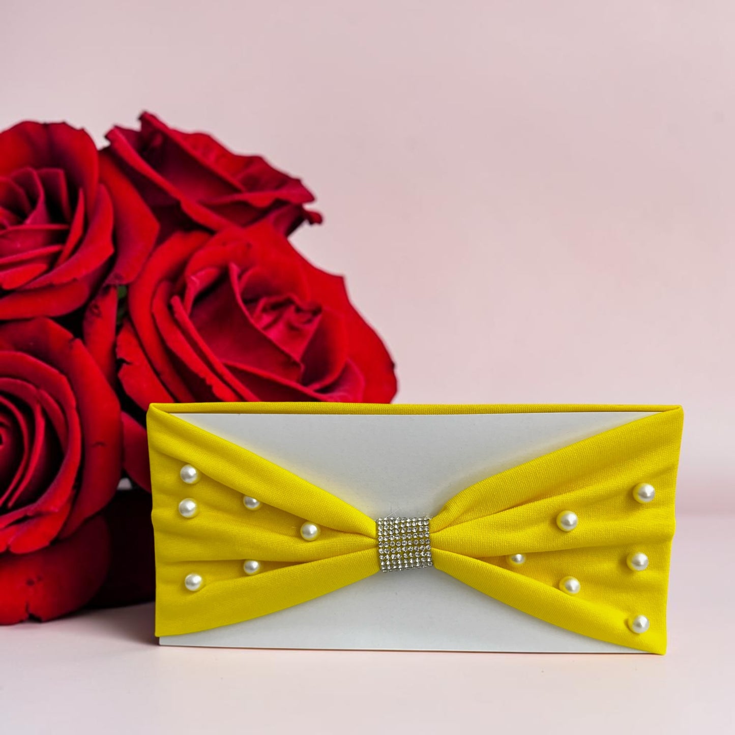 Headbands designed with a center rhinestone and scattered faux pearls.