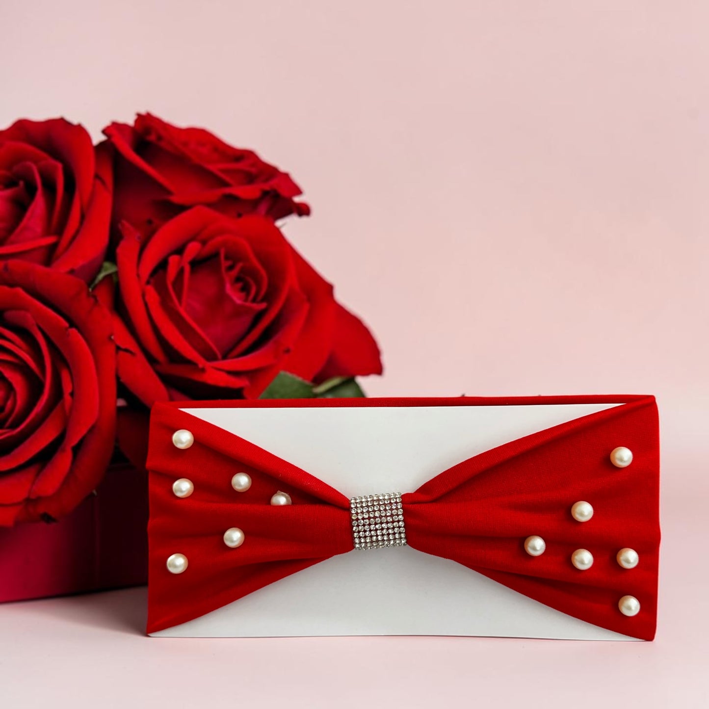 Headbands designed with a center rhinestone and scattered faux pearls.