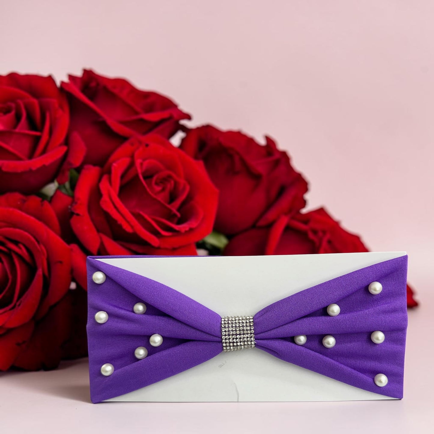 Headbands designed with a center rhinestone and scattered faux pearls.