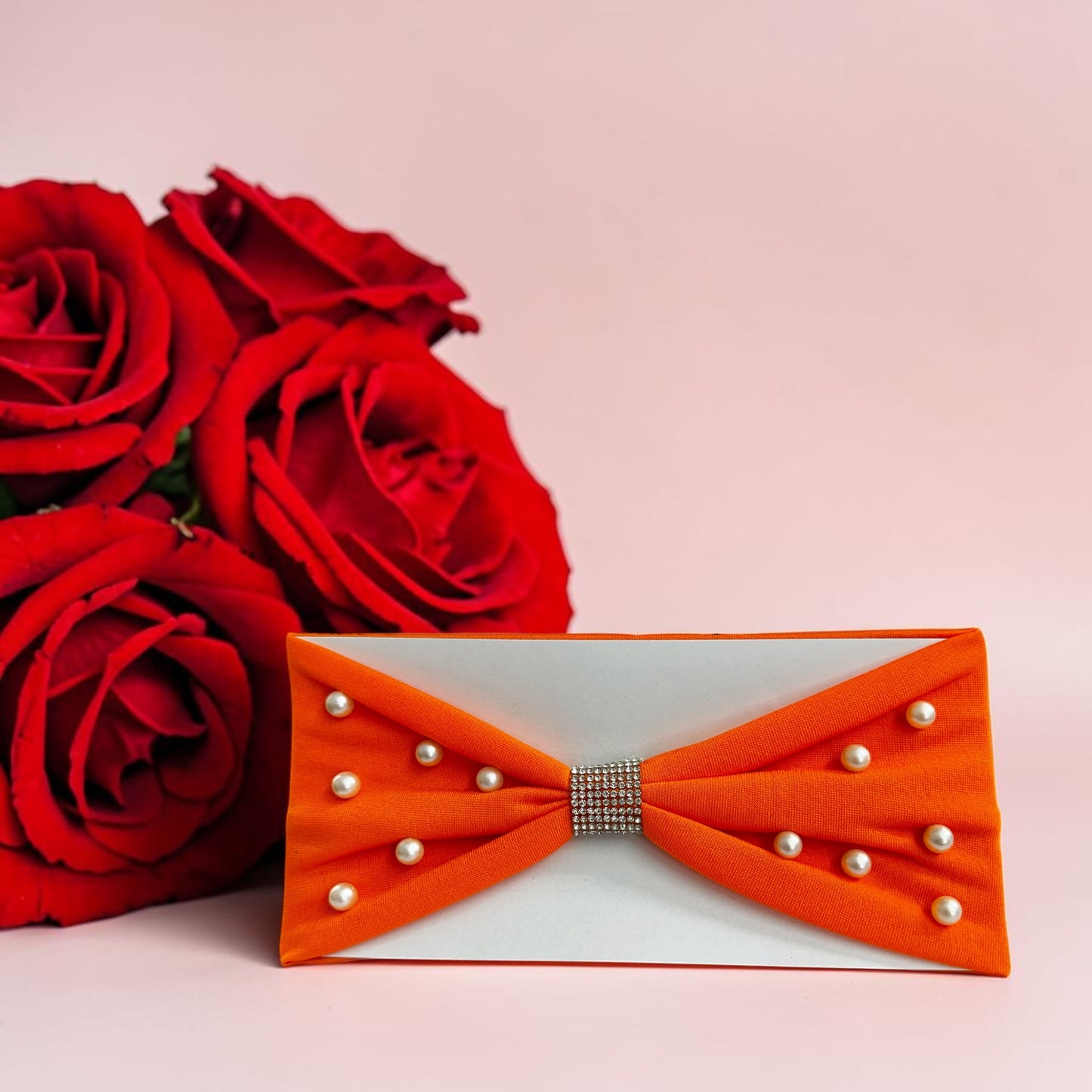 Headbands designed with a center rhinestone and scattered faux pearls.