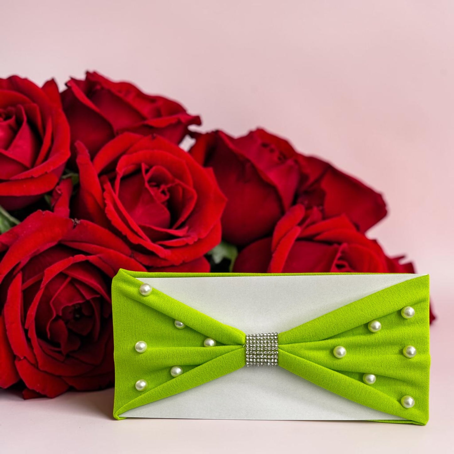 Headbands designed with a center rhinestone and scattered faux pearls.